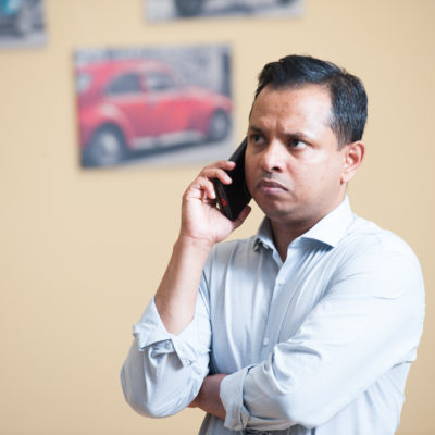 Man in shirt on the phone to the Garda Ombudsman