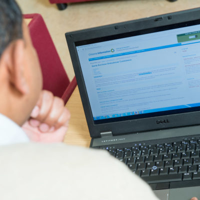 Man reading information on the Garda Ombudsman Commissions