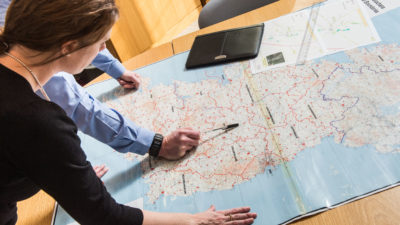 Garda Ombudsman members of staff reviewing map of Ireland